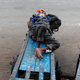 A homeless man sleeps on a cart in Delhi.